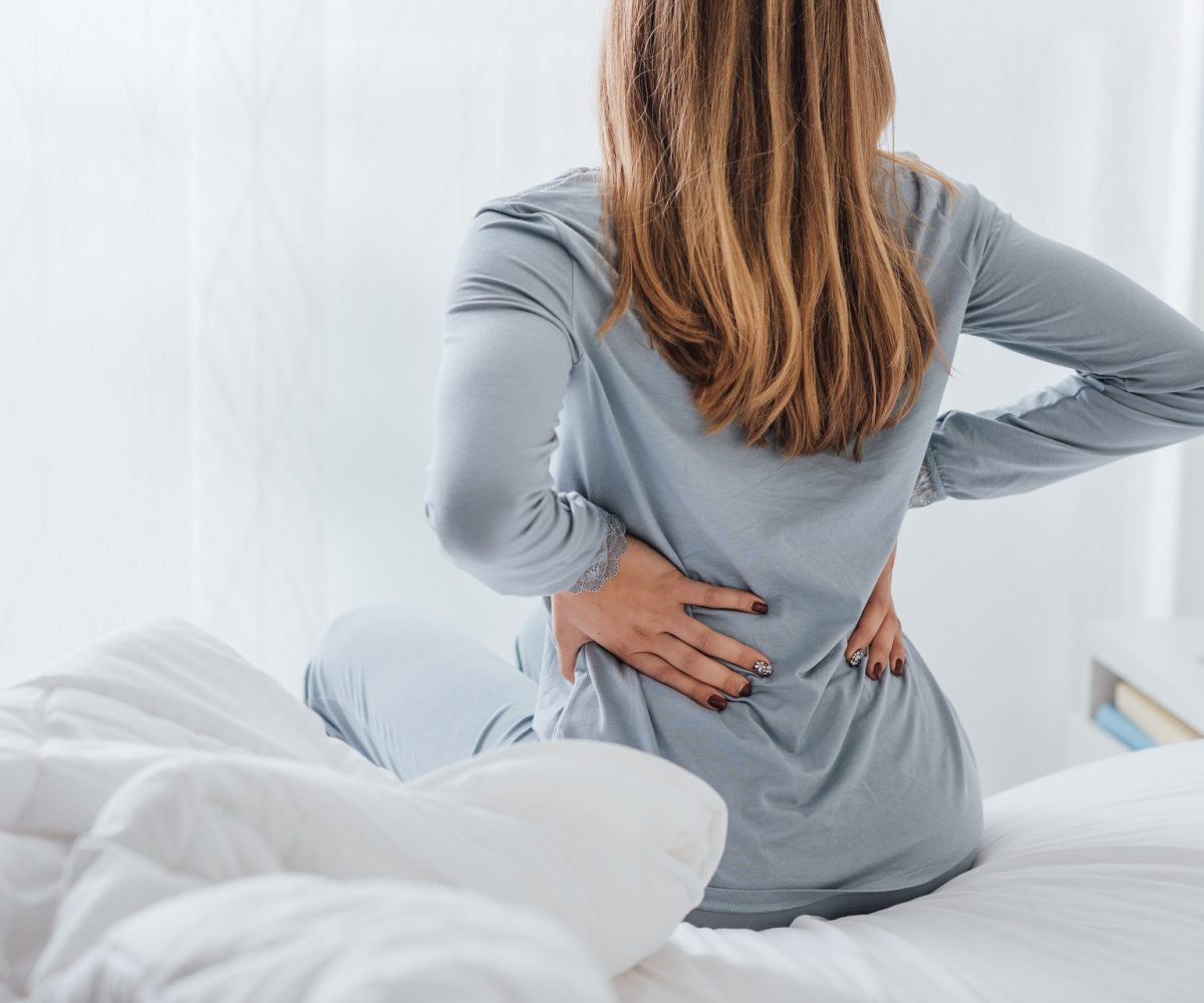 Woman with Back Ache | Hudson PT Premier Physical Therapy Clinic Union City and Jersey City, NJ,